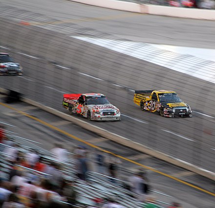 Bodine (#30) battling with Mike Skinner at TMS in 2007.