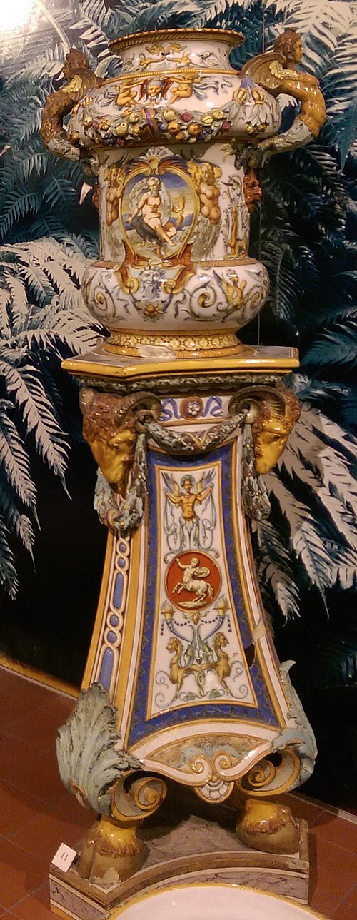 Minton tin-glazed Majolica flower pot and stand imitating Italian Renaissance maiolica process and 'grotesque' style. Potteries Museum, Stoke-on-Trent