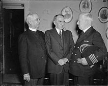 Washington, D.C., March 25, 1937: Navy Chaplain Edward Duff opens the House of Representatives with a prayer for the first time since 1820. It was the first time in 117 years that the Navy was again honored in giving the invocation. Left to right: James S. Montgomery, Chaplain of the House; Speaker William Bankhead; and Capt. Edward A. Duff, Chief of Chaplains U.S. Navy Navy Chaplain Edward Duff opens House session.jpg