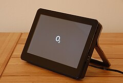 An O2 Joggler displaying the O2 logo while booting.