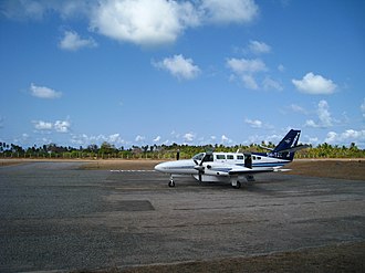 A Tanzanair aircraft at Songo Songo Airstrip Our flying machine.jpg