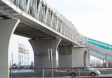 Pickering Pedestrian Bridge spanning railway tracks, Highway 401, and Pickering Parkway at Pickering GO Station