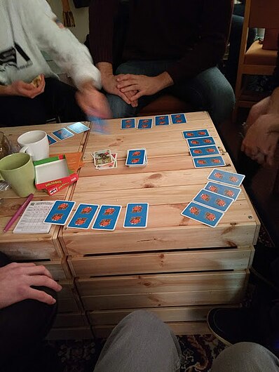 People playing board game card game in circle.jpg