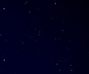 An image of the carbon star R Leporis as seen in binoculars. R Leporis is the red star right of centre. The bright star in the lower left corner is Mu Leporis.