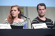 Adams with Henry Cavill at the Batman v Superman panel at the Comic-Con International (11 July 2015)