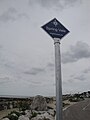 A new public footpath sign at Springvale, Seaview, Isle of Wight. The new signs were put up in April 2011 to help mark public footpaths, with all coastal routes given a blue sign and inland routes given a green sign.