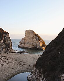 Shark Fin Cove, a noted photographers spot along the coast of Davenport.