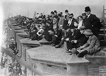1910 brought the first World Series - and rooftop bleachers across 20th St. from the park, a 25-year dispute between neighbors Shibe Park Fans.jpg