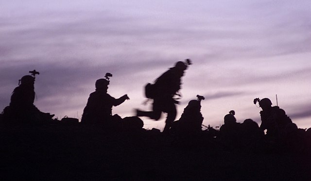 U.S. soldiers from the 10th Mountain Division (Light Infantry) prepare to dig into fighting positions during Operation Anaconda in March 2002.
