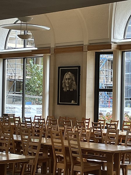 Dining hall with a drawing of Carole Souter, the college's master between 2016 and 2022