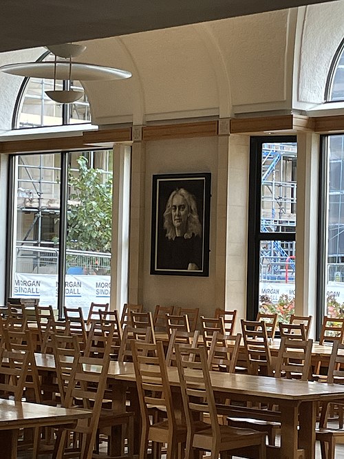 Dining hall with a drawing of Carole Souter, the college's master between 2016 and 2022