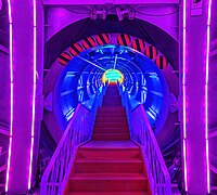 Stairs lit with colorful neon lights inside a corridor of the Atomium in Brussels Belgium.jpg