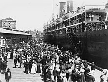 People on a quayside bidding farewell to passengers aboard Osterley, about 1910 StateLibQld 1 184783 Osterley (ship).jpg