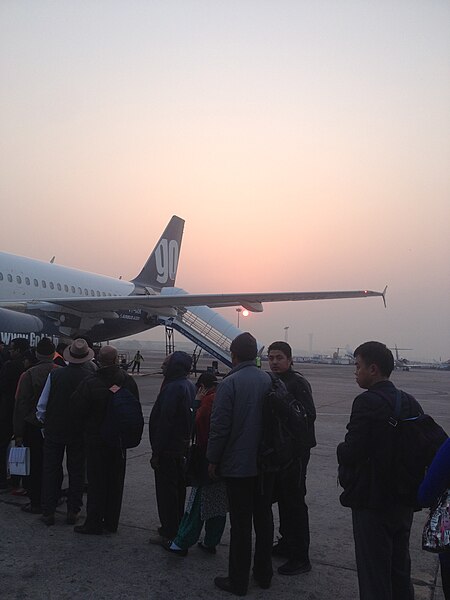 File:Sunset in Delhi Airport terminal 1D as seen below a GoAir flight.jpg