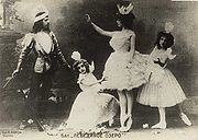 Mikhail Mordkin as Prince Siegfried and Adelaide Giuri as Odette with students as the little swans in the Moscow Imperial Bolshoi Theatre's production of the Petipa/Ivanov/Tchaikovsky Swan Lake. 1901 Swanlakemordkin.jpg