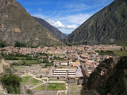 The town of Ollantaytambo, with some of the ruins and the souvenir market in the foreground