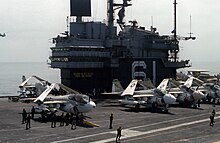 VAQ-137 EA-6B #624 on board USS Ranger in 1980. A-6 Intruders are also visible. USS Ranger (CV-61) flightdeck and island 1980.jpg