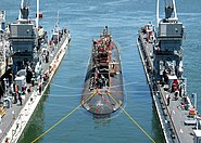 Los Angeles class fast attack submarine USS Asheville (SSN-758) enters the floating dry dock of Arco (ARDM-5) for scheduled maintenance.