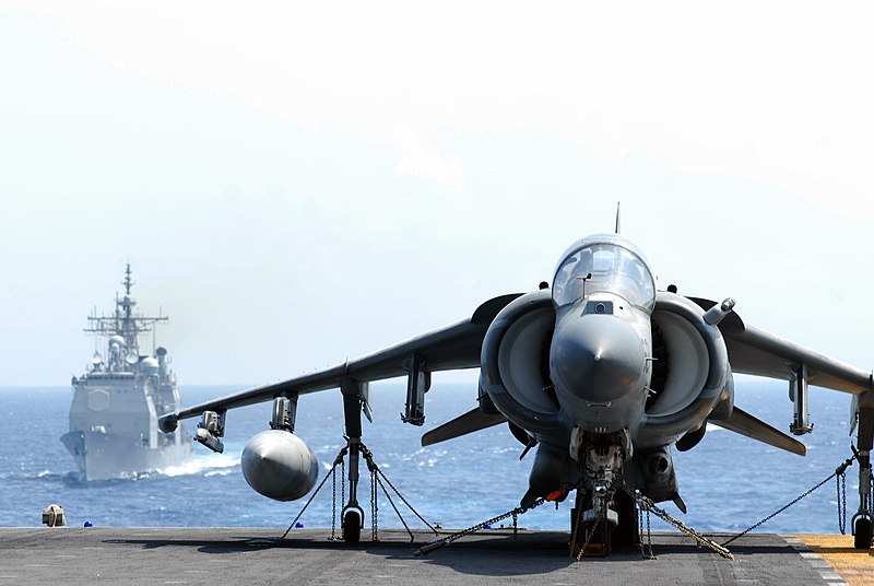 File:US Navy 070620-N-5033P-125 An A-V-8B Harrier rests on the flight deck of amphibious assault ship USS Kearsarge (LHD 3) as guided missile cruiser USS Vicksburg (CG 69) approaches.jpg