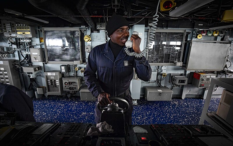 File:US Navy 171101-N-UY653-076 Seaman mans the helm of USS Oscar Austin.jpg