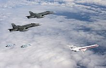 CF-18s of the Royal Canadian Air Force and Su-27s of the Russian Air Force escort a simulated hijacked aircraft during Vigilant Eagle 2013. VigEagleRusCAN.jpg