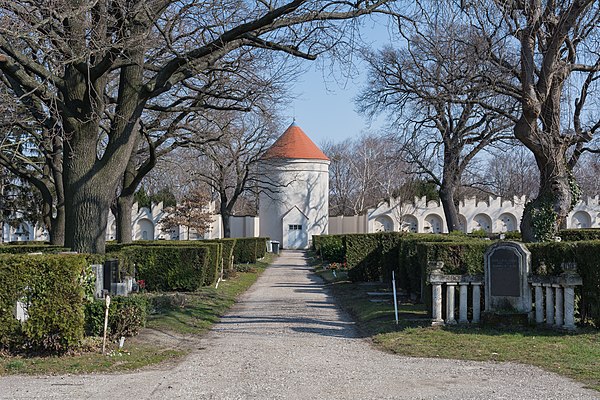 Urn burial ground with old Schloss Neugebäude tower