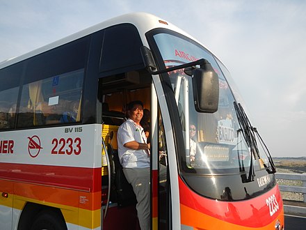 Conductor on a provincial bus in Pangasinan