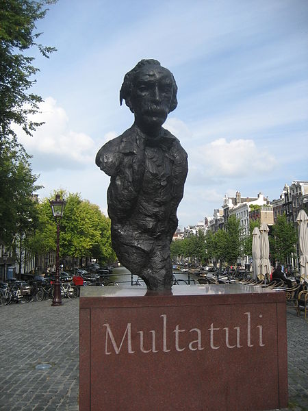 Statue of Multatuli on a square over the Singel canal in Amsterdam.