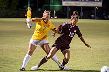 The Mustangs women's soccer team in action against Texas A&M-Commerce in 2014 Athletics-Soccer vs MWU-5228 (15373863647).jpg