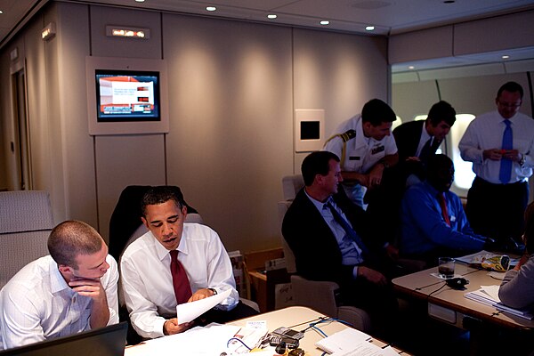 Obama works with Favreau on the President's Normandy speech aboard Air Force One en route to Paris on June 5, 2009.