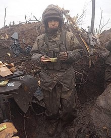 Ukrainian soldier in a trench during the Battle of Bakhmut. Hundreds of thousands of people have been killed in the Russo-Ukrainian War since February 2022. Battle of Bakhmut 3.jpg
