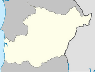 Mapa konturowa dystryktu Beja, blisko centrum u góry znajduje się punkt z opisem „Beja”