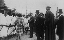 Wilhelm II, German Emperor during a visit on 1909, speaking with human exhibitions.