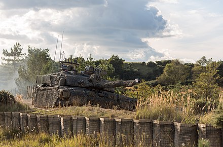 A British Challenger 2 Theatre Entry Standard fitted with a mobile camouflage system.