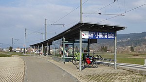 Station shelter next to railway track