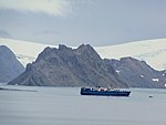 Closeup supply ship and snowless mountian Admiralty Bay King George Island Coral Princess Antarctica.jpg