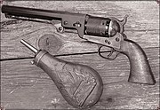 Colt 1851 Navy with powder flask