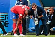 Venegas receiving instructions from coach Oscar Ramirez at the 2018 FIFA World Cup Cos-Serb (8).jpg