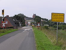 Ortseingangsschild von Dagebüll-Kirche bei der Einfahrt vom sogenannten Osterdeich