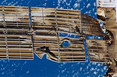 Damaged solar array of the Spektr module after Progress M-34 freighter colliding with the Mir space station on June 25, 1997 Damaged Spektr solar array.jpg