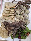 The Mongolian trifecta: ''khuushuur'' fried dumplings on the left, ''buuz'' steamed dumplings on the right, and pieces of boiled mutton on top