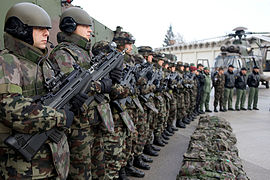 Soldiers of the Slovenian Armed Forces, Joint Forces Command Headquarters here stand in formation with an F2000 S during an operational brief for Admiral James G. Stavridis, Supreme Allied Commander Europe, U.S. European Command commander, Nov. 13, 2009.