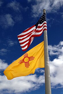 U.S. and New Mexican flags flying near Deming, February 2014. Flags flying, U.S. and New Mexico, February 2014.jpg