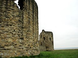 The massive stone keep, curtain wall and three-storey corner tower. Flint 2.jpg