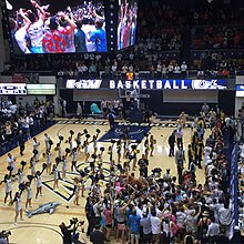 GW fans storm the court after the Colonials defeated the Virginia Cavaliers in 2015. GWvsVirginiaBasketball.jpg