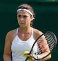 Gabriella Taylor competing in the first round of the 2015 Wimbledon Qualifying Tournament at the Bank of England Sports Grounds in Roehampton, England. The winners of three rounds of competition qualify for the main draw of Wimbledon the following week.