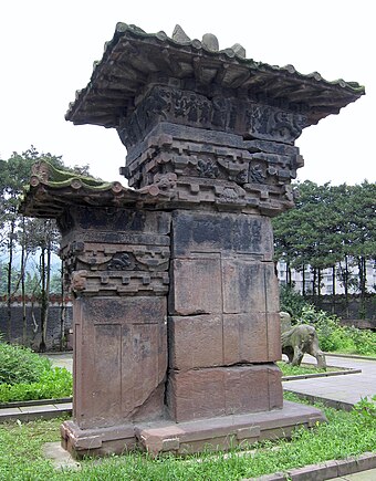 A stone-carved gate pillar, or que, 6 metres (20 ft) in total height, located at the tomb of Gao Yi in Ya'an, Sichuan, built during the Eastern Han dynasty (25–220 CE)