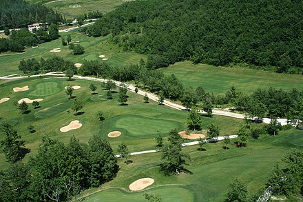 An aerial view of a golf course in Italy
