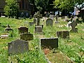 Gravestones in the churchyard of Saint John the Evangelist in Sidcup.