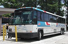 An integral bodywork MCI 102DL3, an intercity bus owned by Greyhound Lines, typical of those used in the 1990s and early 2000s. Greyhound Bus 6080.jpg